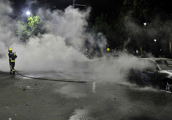 Car fire extingushed on a street in Ealing