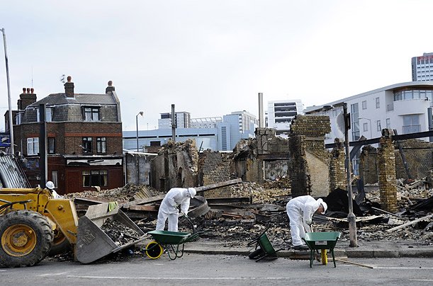 Charred remains of Reeves furniture shop Croydon, South London, following riots on Monday