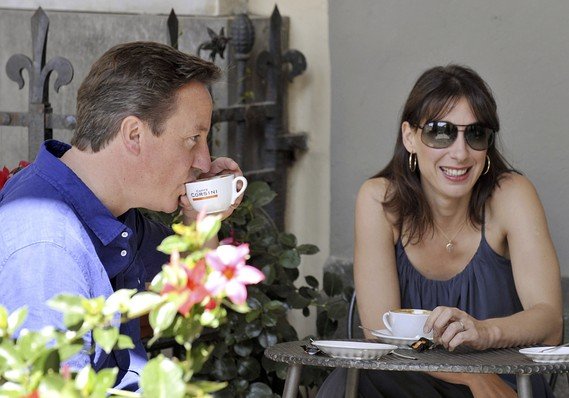 PM David Cameron and his wife, Samantha, outside a cafe near Siena Italy where they have been in vacation during the last weekend London riots