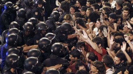 People violently protesting against the exorbitant cost of Pope Benedict XVI visit to Madrid