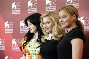 Andrea Riseborough, Madonna and Abbie Cornish pose at the photo call for the film W.E. during the 68th edition of the Venice Film Festival. (AP photo)