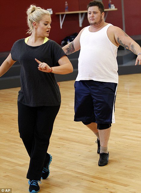 Chaz Bono and his dancer partner Lacey Schwmmer rehearse for the show Chaz Bono and his dancer partner Lacey Schwmmer rehearse for the show photo