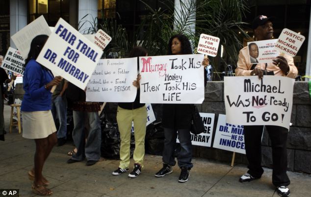 Demonstrators for and against Dr Conrad Murray