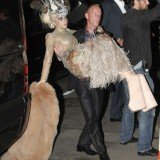 Lady Gaga carried by the bodyguard as she couldn't walk in her block heels.