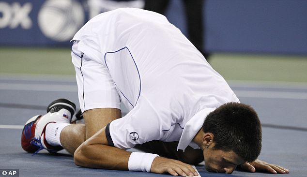 Novak Djokovic kissing the court after his victory