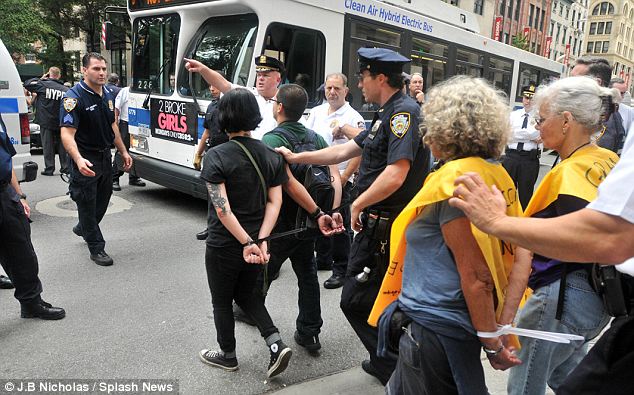 Occupy Wall Street demonstrators were arrested, cuffed with plastic tags and dragged on to sidewalks