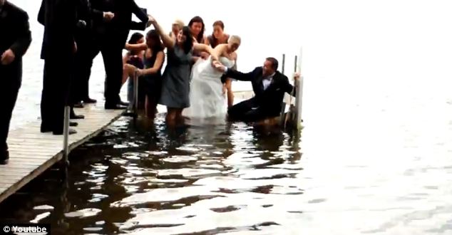 The dock over Sugarloaf Lake in Michigan collapses when the bridal group step onto it