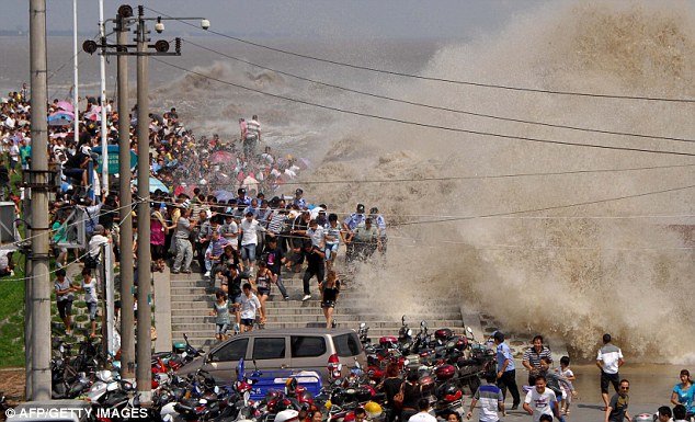 Viewing the tidal bore has become an annual tradition for people living by the mouth of the Qiantang River and a popular attraction for visitors as well