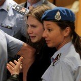 Amanda Knox bursts into tears after she was sensationally cleared of the murder of Meredith Kercher