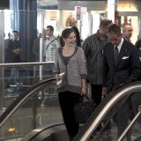 Amanda Knox smiles at other passengers at Leonardo Da Vinci airport in Fiumicino this morning before boarding a flight to Seattle via London