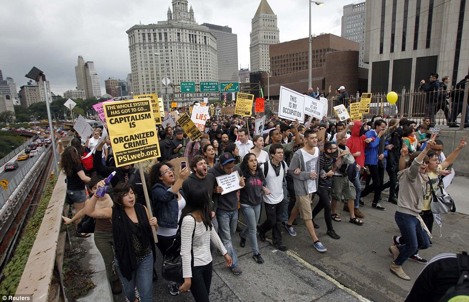 Around 1,500 protesters march over the Brooklyn Bridge in New York during an Occupy Wall Street protest 