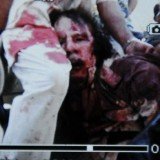 Muammar Gaddafi Wounded or Dead Corpse