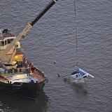 The Bell 206 tourist helicopter, which was not equipped with floats, was pulled from the East River hours after the crash
