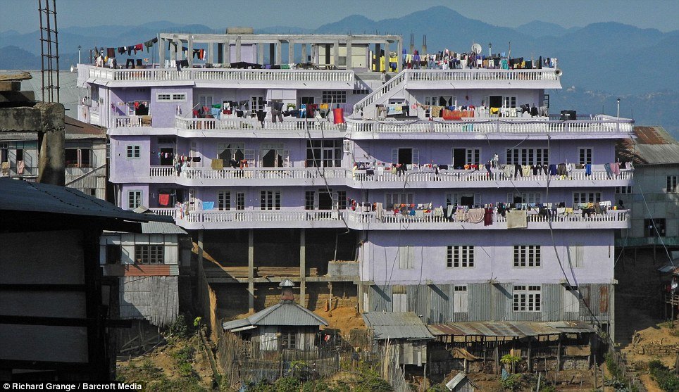 Ziona Chana’s home has 100 rooms and  is a four-storey house set in the village of Baktwang, state Mizoram, India