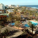 A British tourist was left dangling naked, upside down, in the stairwell of a hotel from Tenerife, Spain, after she tumbled over a handrail while having sex with her husband
