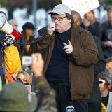 Michael Moore is the booming voice of the Occupy protests, encouraging activists to continue their battle against the wealthy one per cent of Americans, but he has been uncharacteristically quiet about one thing: his own wealth.
