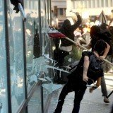 Occupy Oakland protesters shut down one of the nation's busiest shipping ports, vandalizing businesses and smashing bank windows