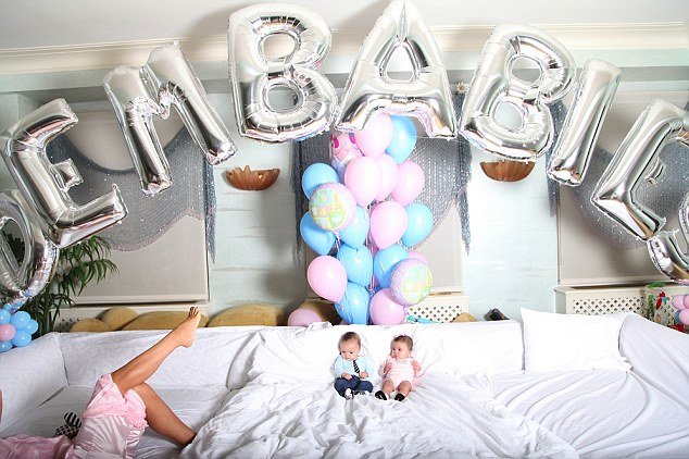 The charming twins, Moroccan and Monroe look like they are on cloud nine as they recline on a giant white sofa with an array of colourful balloons behind them