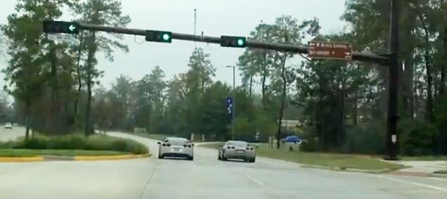 Two testosterone-fuelled Corvette drivers line up at a set of traffic lights and prepare to settle the best in a drag race in The Woodlands, Houston