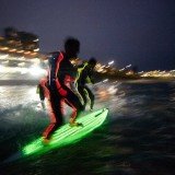 17 Strongbow-sponsored surfers took to the water for the largest ever glow-in-the-dark surf attempt in front of hundreds of fans who lined Bondi Beach in Australia