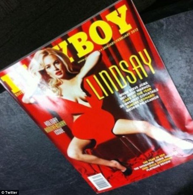 Lindsay Lohan, 25, is seen straddling a Playboy bunny shaped chair which manages to cover her modesty, but reveals the curve of her breasts
