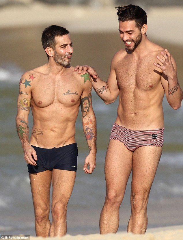 Marc Jacobs, 48, showed that he's still keeping in great shape by flaunting his incredibly ripped beach body as he walked along the St. Barts beach with his equally muscular ex-fiance Lorenzo Martone