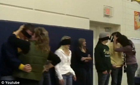 Rosemount High School winter-sport team captains were blindfolded as their mothers and fathers approached and kissed them
