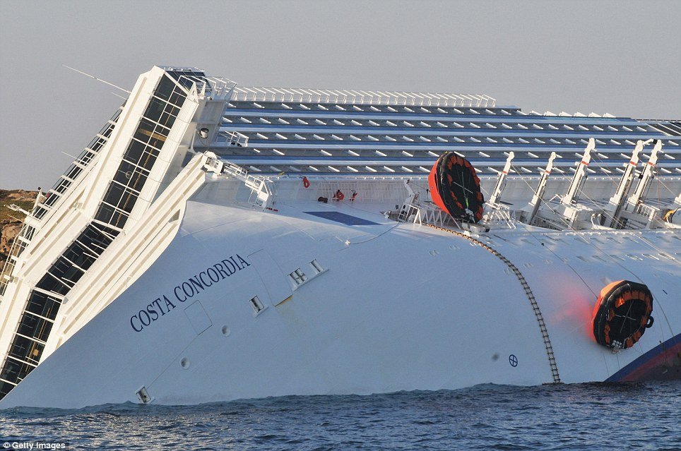 Divers searching the wreck of Costa Concordia cruise ship have found the body of a woman, bringing the death toll to 17