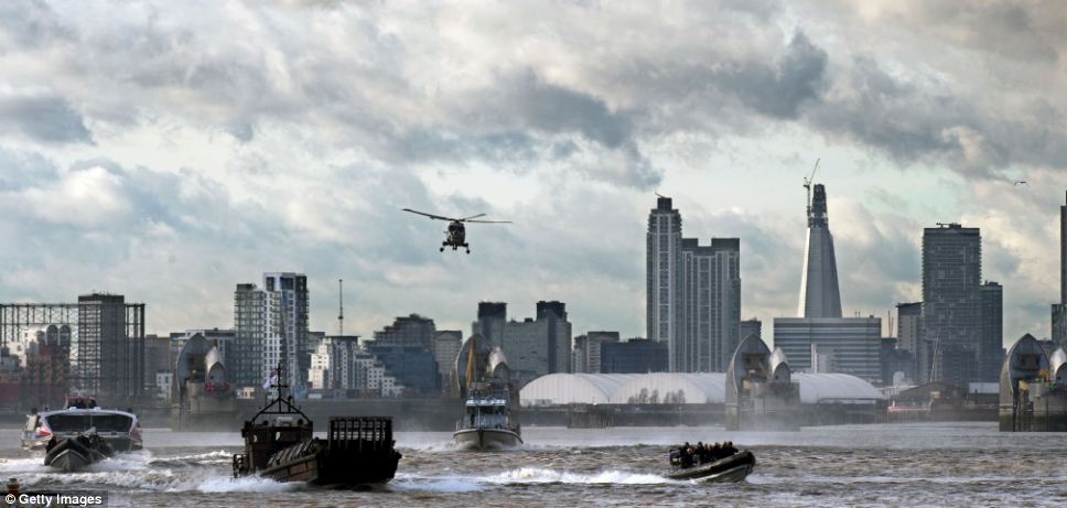 Royal Marines and Scotland Yard took command of the River Thames yesterday in a determined show of strength as part of a security exercise for the London Olympics called Operation Woolwich Arsenal Pier