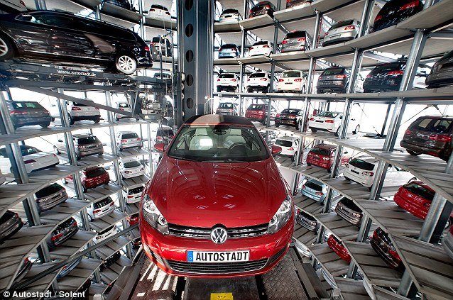 Volkswagen Autostadt CustomerCenter futuristic garages are the ultimate car showrooms with millions of dollars worth of new vehicles sitting in the stunning glass towers