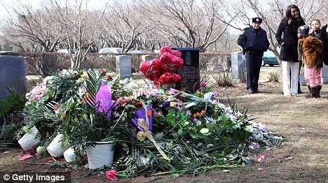 A day after Whitney Houston was buried at Fairview Cemetery in New Jersey her grave appeared covered by flower