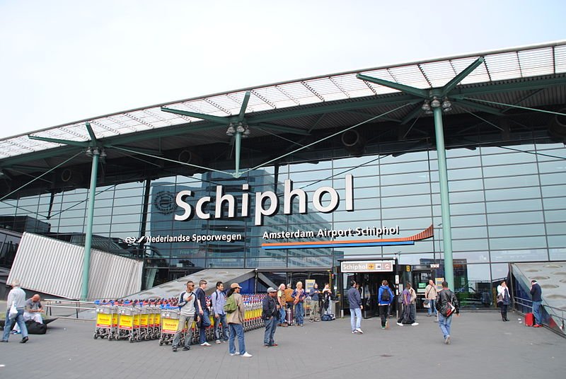Amsterdam's Schiphol airport has been evacuated after Dutch police has arrested a man who locked himself in a toilet and claimed to have a bomb
