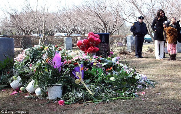 Armed security guards have been placed at Whitney Houston's grave to prevent grave robbers from plundering $500,000 worth of jewels and clothing the singer was buried in