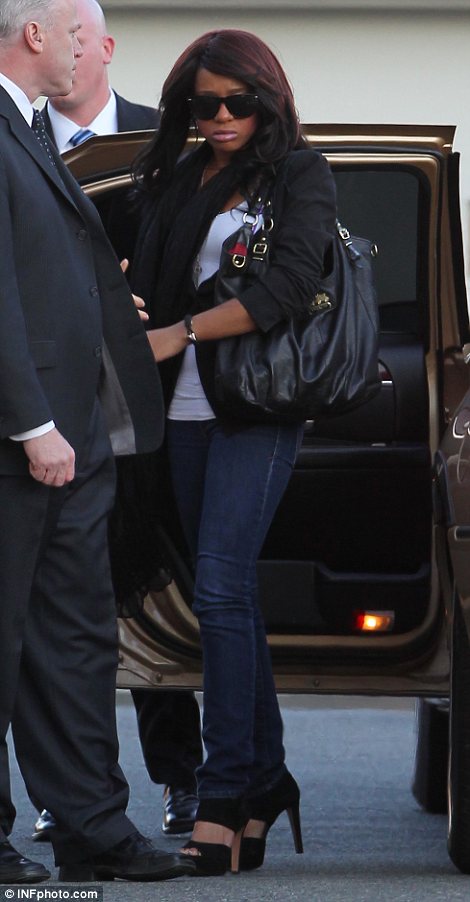 Bobbi Kristina Brown, 18, who made her first appearance since being rushed to hospital after collapsing through stress following her mother's passing, was seen arriving at Whigham Funeral Home in Whitney Houston's hometown of Newark