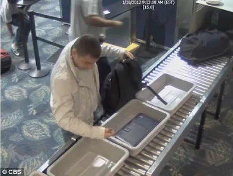 Florida police is searching for a man caught on camera stealing a $6,500 Rolex watch from a fellow passenger at an airport security checkpoint