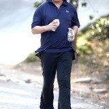 Kiss rocker Gene Simmons looked strangely taut as he jogged in Studio City yesterday with his family