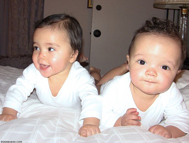 Mariah Carey posted new photos showing her nine-month-old twins Monroe and Moroccan wearing white jumpers, while posing on a bed
