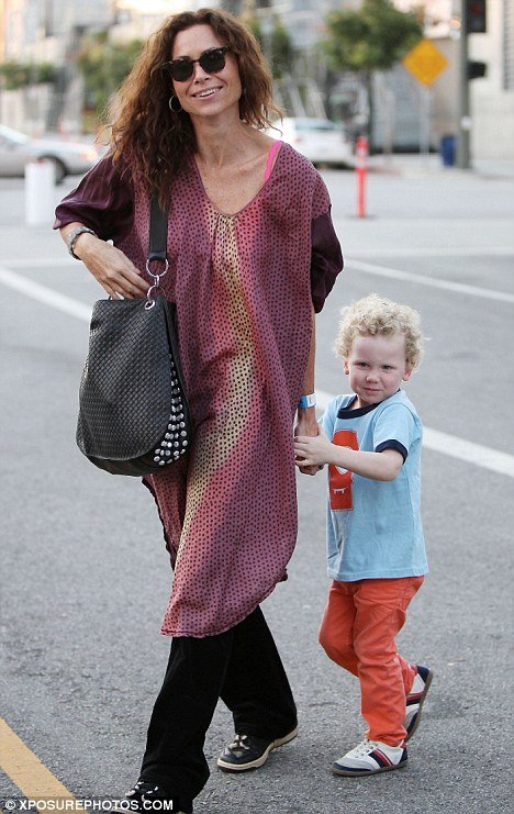 Minnie Driver revealed that three-year-old Henry's dad was a writer on her former television show The Riches
