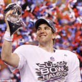 New York Giants quarterback Eli Manning poses with the Vince Lombardi Trophy after the Giants defeated the New England Patriots by a score of 21-17 in Super Bowl XLVI at Lucas Oil Stadium New York Giants quarterback Eli Manning poses with the Vince Lombardi Trophy after the Giants defeated the New England Patriots by a score of 21-17 in Super Bowl XLVI at Lucas Oil Stadium