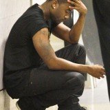 Ray J, Whitney Houston’s on-off lover, was seen overcome with emotion as he arrived back at Los Angeles' LAX airport yesterday following the singer's funeral