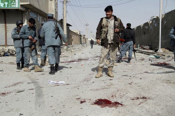 Two civilians and at least five police officers have died in a car bomb attack on police headquarters in the city of Kandahar, southern Afghanistan