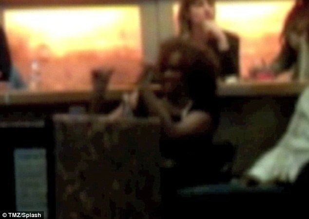 Whitney Houston was pictured just five days before her tragic death dancing to Madonna's Super Bowl half-time performance
