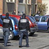 French police have arrested 19 suspected Islamists and seized weapons in a series of dawn raids
