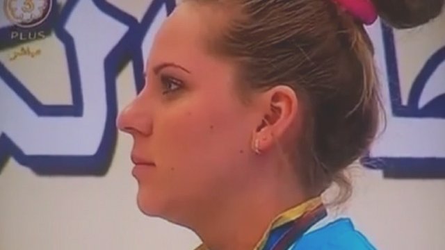 Kazakh gold medalist Maria Dmitrienko listened to the Borat anthem without emotion and finally smiling as it ends