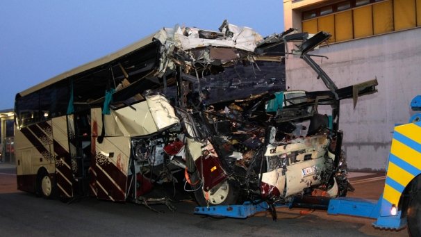 The coach, carrying 52 people back to Belgium, hit a wall in the tunnel head-on