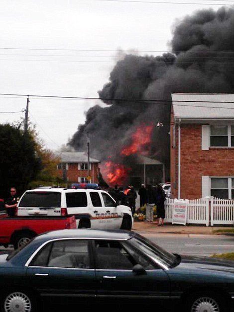 A US Navy F-18 fighter jet has crashed into an apartment complex in the suburbs of Virginia Beach