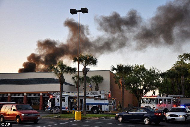 A witness reported that the twin-engine plane appeared to have crashed into the roof of a Publix chain supermarket
