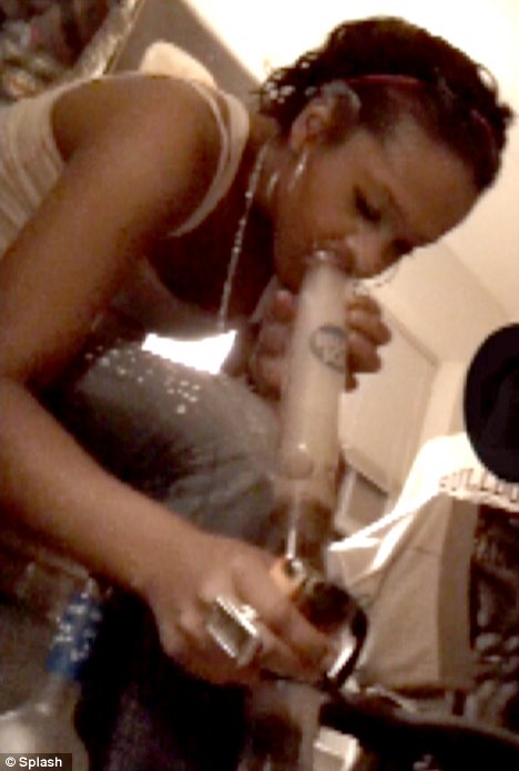 Bobbi Kristina Brown is seen smoking what appears to be marijuana out of a bong in an image taken from a video filmed in March 2011