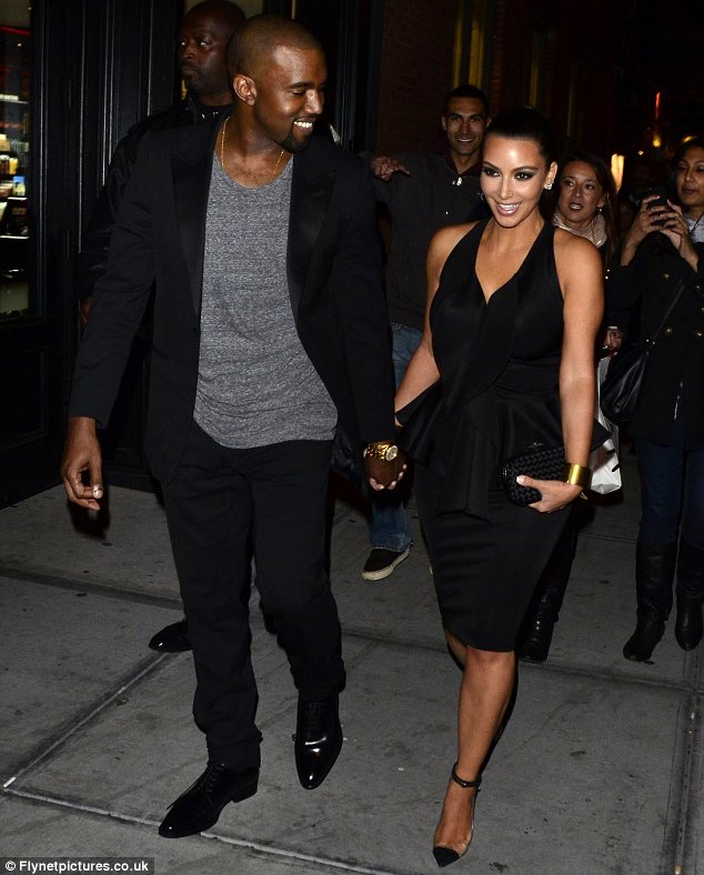 Kim Kardashian and Kanye West arrived together holding hands to the opening of Kourtney's boyfriend Scott Disick's restaurant
