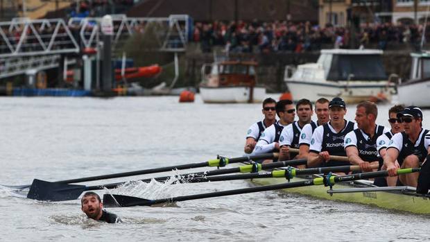 The 158th Oxford and Cambridge Boat Race on River Thames, UK, had to be halted midway through because of a swimmer